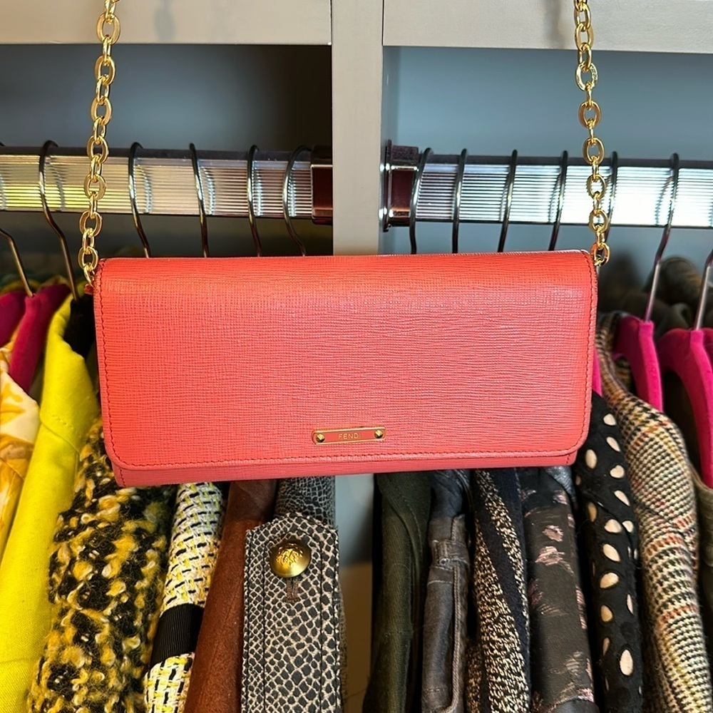 Authentic Fendi salmon colored leather wallet on unbranded gold tone chain